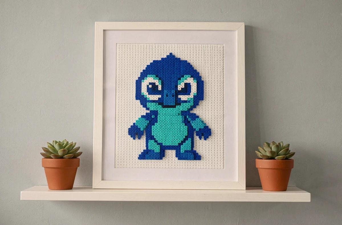 Tableau décoratif encadré avec motif Stitch en perles à repasser accroché sur un mur gris clair